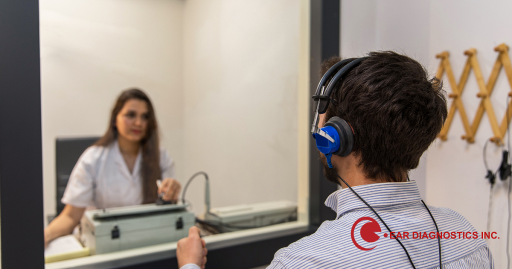 Picture of a man doing a hearing test